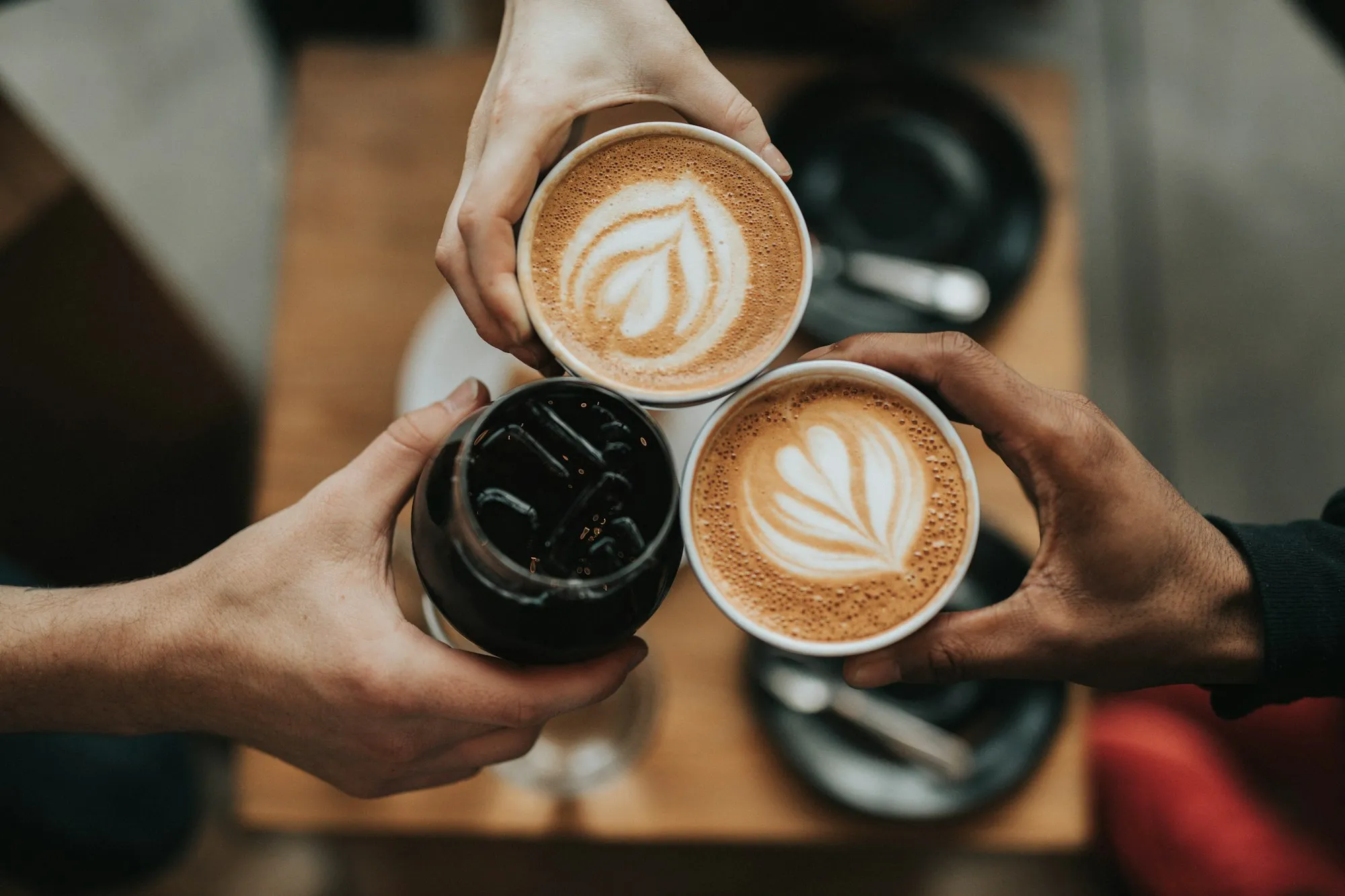 Coffee being poured into a cup at the café counter