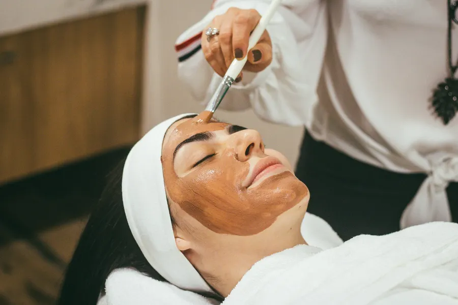 A facial treatment with a mask during a beauty ritual