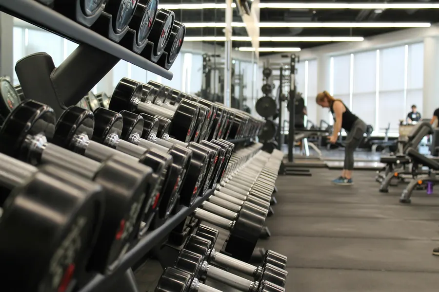 A gym or fitness studio website showing the class schedule and a free trial signup button
