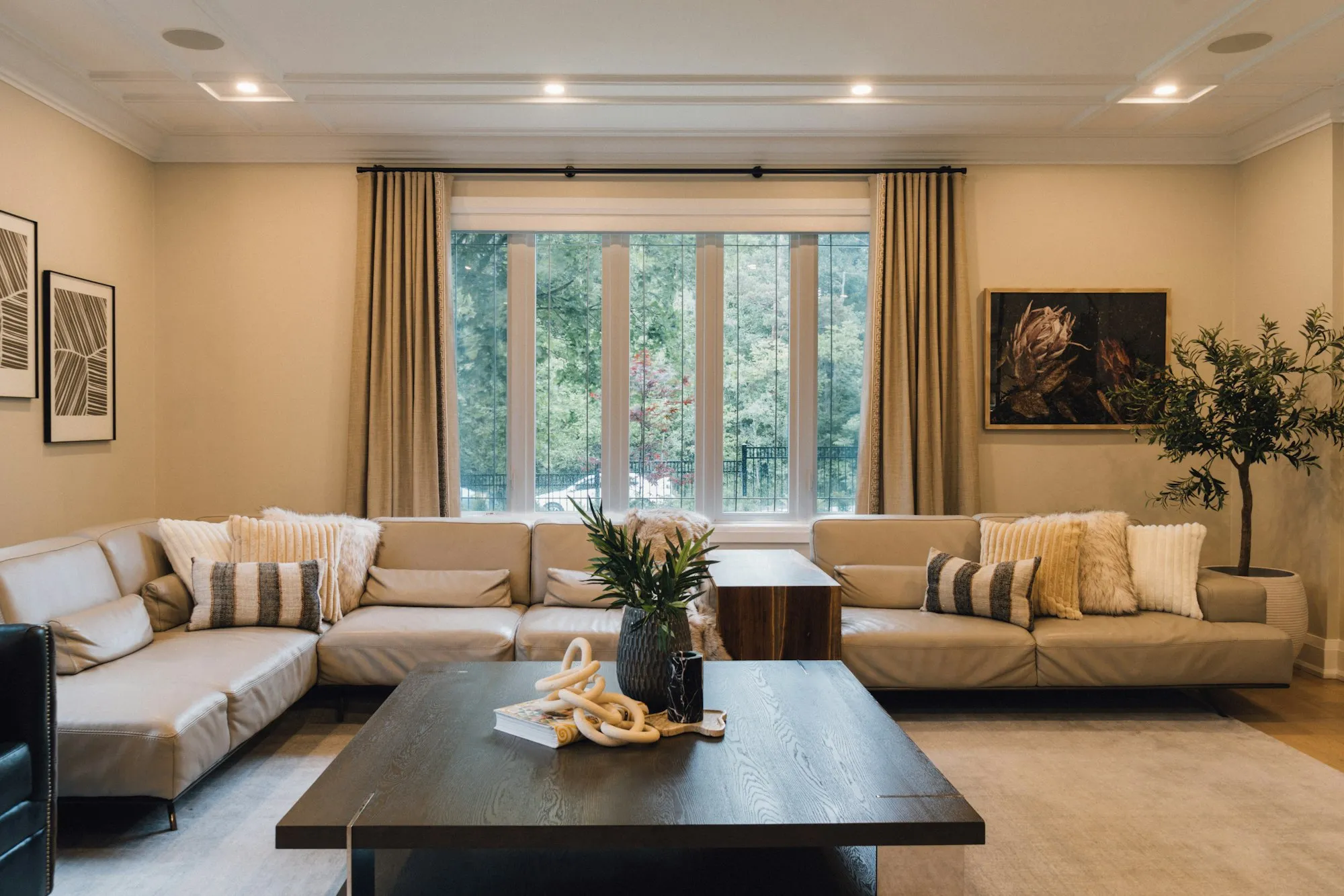 Bright living room with a large wall to paint